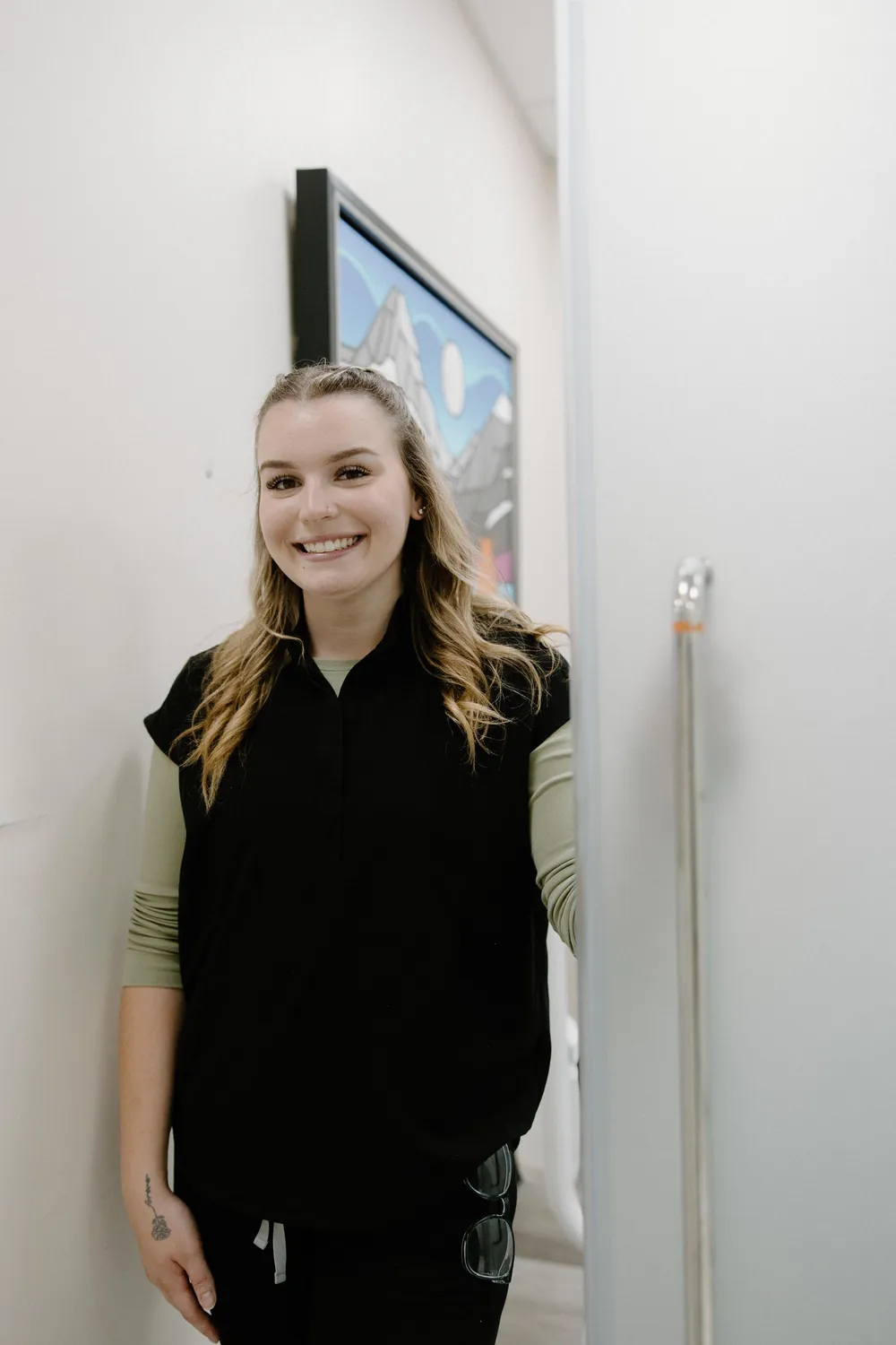 Smiles @ Southgate dental team member in black scrubs